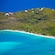 The sandy beach and lush vegetation of Magens Bay in Saint Thomas